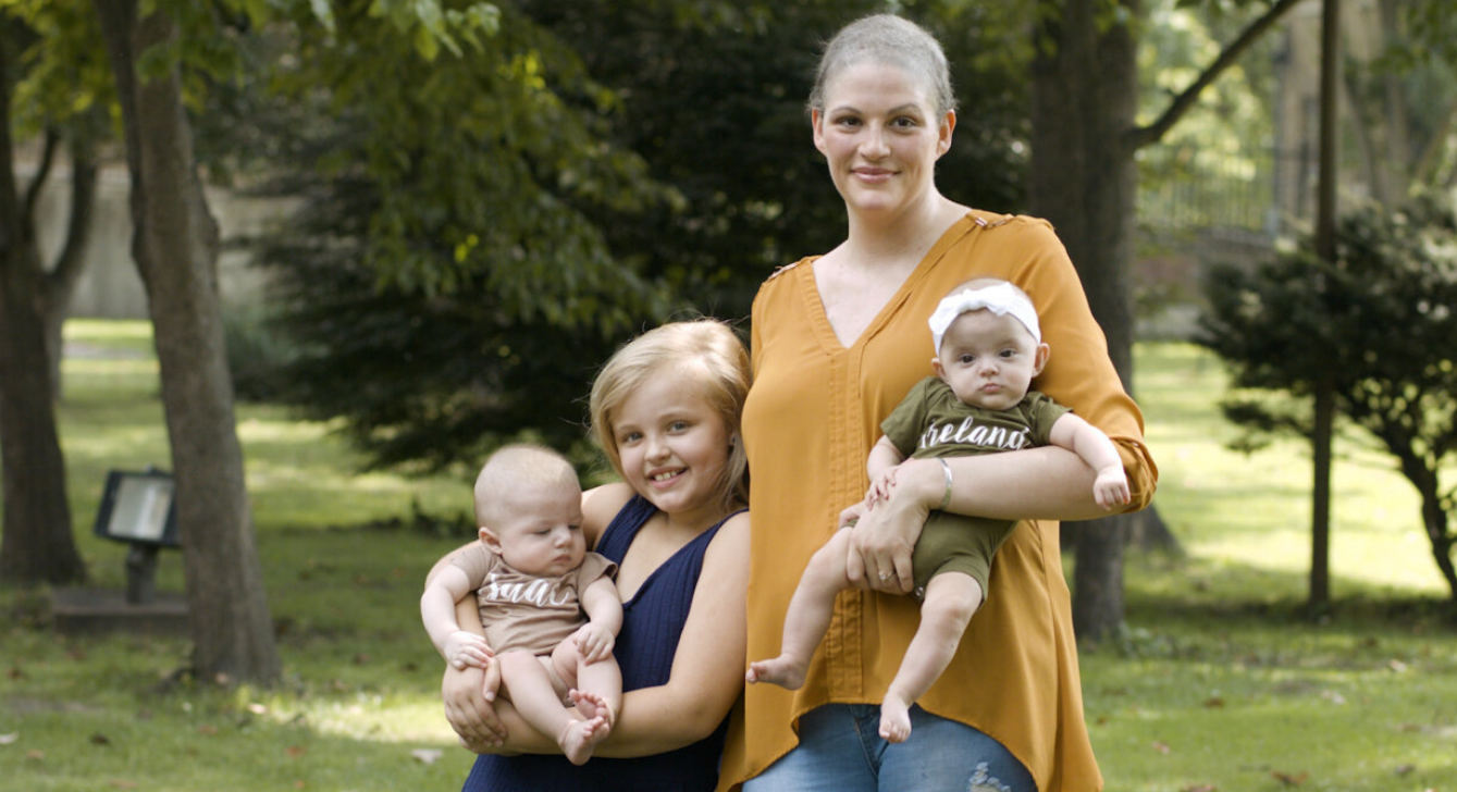 Image of a breast cancer survivor and her children to emphasize the continuum of care Gateway to Hope provides.